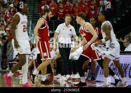 Nebraska head coach Fred Hoiberg cheers from the sideline as his team