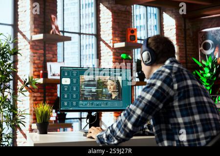 Man listening music uses AI GPT application turning text prompt into photos. Person wearing headphones, hearing podcasts, using text to image generative models with neural network tech Stock Photo
