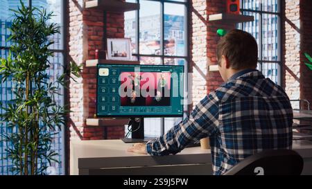 Man in apartment workspace using AI software turning text prompt into photos. Person in brick wall home uses text to image artificial intelligence generative models on computer, camera A Stock Photo