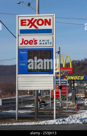 A sign at Joe's Kwik Marts displays Exxon fuel prices in Harrisburg, Pa