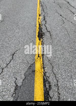 Yellow line in the middle of a road Stock Photo
