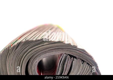 Close-up of the end of a magazine rolled up Stock Photo