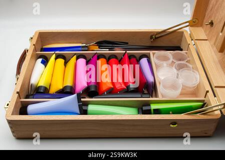 Colorful artist's paint set in wooden case. Stock Photo