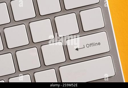 Close-up of an offline key on a computer keyboard, highlighting the concept of disconnecting from the internet or network Stock Photo