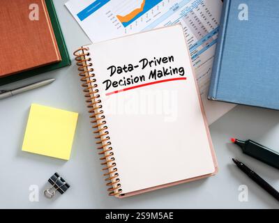 Data-driven decision making process concept improving business results, open notepad on office desk Stock Photo