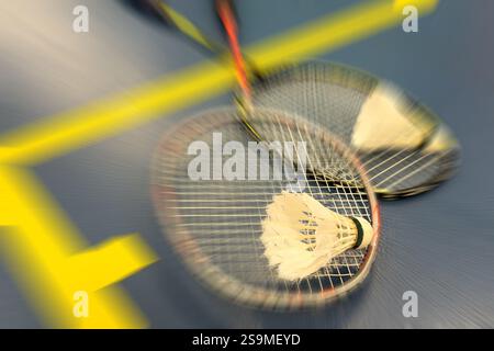 Shuttlecocks and badminton rackets on blue background. Top view. High quality photo Stock Photo