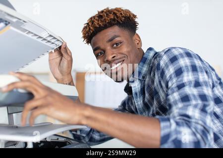 man working on professional printer Stock Photo