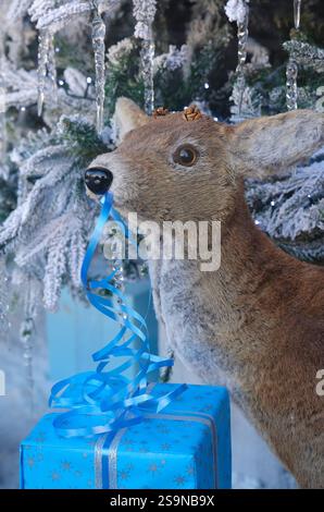 Festive artificial Christmas tree display with warm glowing lights ...