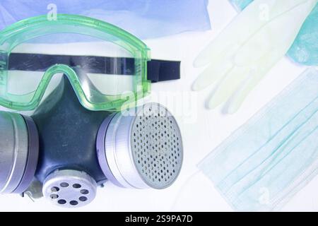 Goggles and gas mask with associated protective gloves and masks Stock Photo