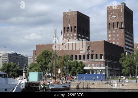 View of a harbour with a sailing ship and striking brick buildings in the background, Oslo, norway Stock Photo