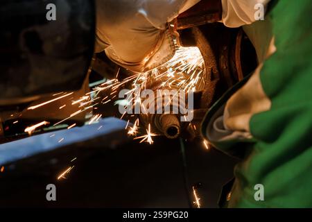 Sparks Fly as a Mechanic Performs Precision Metal Work. Stock Photo