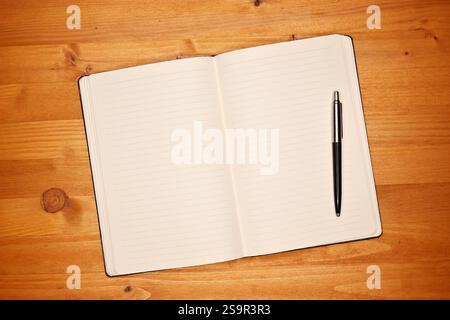 Notebook on office desk, open diary with blank white pages for text mockup, top view Stock Photo