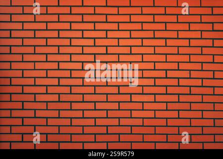 New red brick wall with black mortar joints as background Stock Photo