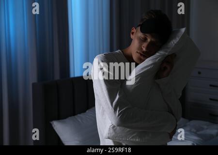 Young man suffering from sleepwalking at home Stock Photo