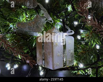 Christmas tree decoration in the form of a white gift box Stock Photo