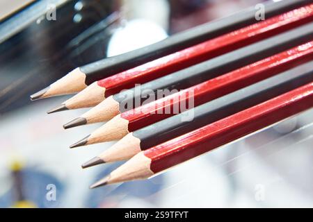 Row graphite pencils on glass Stock Photo