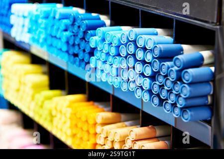 Colored blue yellow markers on a store shelf Stock Photo