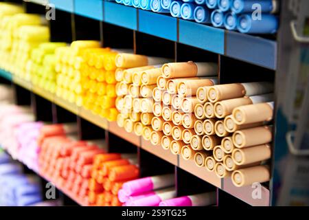 Colored beige blue yellow markers on a store shelf Stock Photo