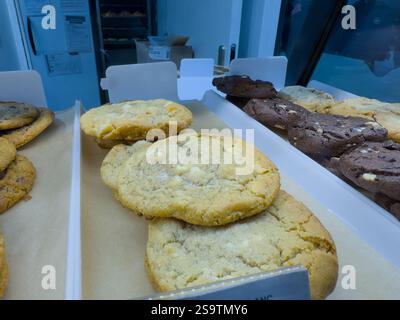 Freshly baked cookies delight customers at a cozy bakery in the heart of town Stock Photo