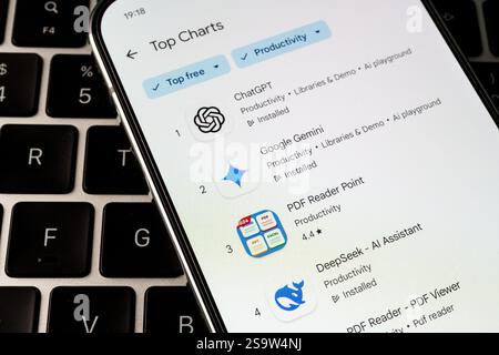 Smartphone with DeepSeek AI app in Google app store seen in in the top downloads competing with ChatGPT and Gemini AI. Stafford, United Kingdom, Janua Stock Photo