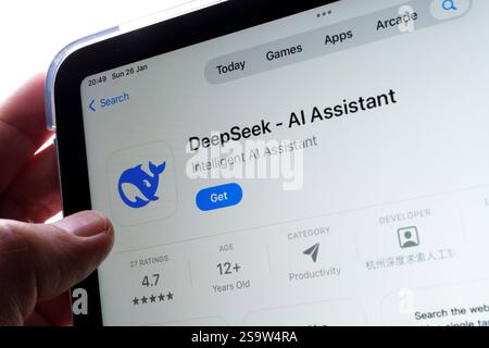 DeepSeek AI Assistant app seen in app store on the ipad and the finger is touching the logotype and Get button. Stafford, United Kingdom, January 26, Stock Photo