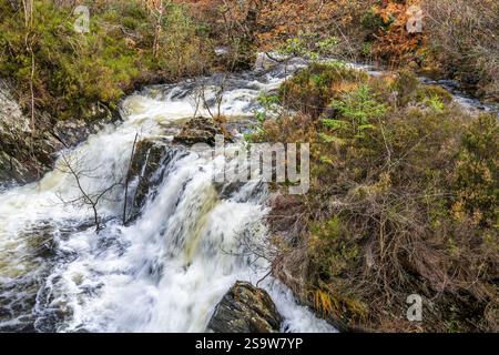 Waterfall on Achray Water downstream of Loch Katrine dam in Trossachs, Scotland, UK Stock Photo
