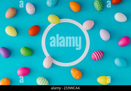 Colorful pattern composition made of various colored Easter eggs on light blue background with copy space. Minimal Easter concept. Stock Photo