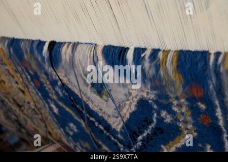 Fes, Morocco. Hand loomed Berber rugs. Work in progress Stock Photo