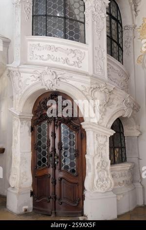 Munich, Germany. Carved wall ornamentation and old wooden door. Stock Photo