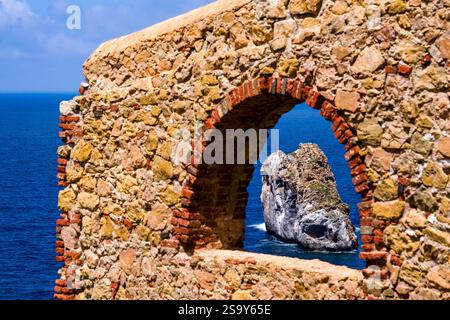 Ruined factory walls of Laveria Lamarmora, a former processing plant for zinc ore, situated on the shore below Nebida. Nebida Sardinia Italy FB 2024 1 Stock Photo