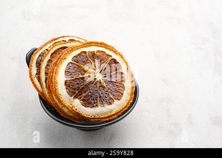 Dried orange slices on white background Stock Photo