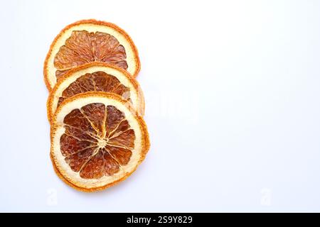 Dried orange slices on white background Stock Photo