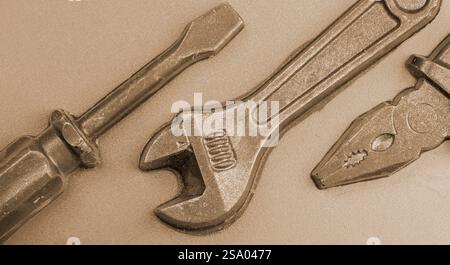 wrench and screwdriver on grey background, closeup of photo Stock Photo