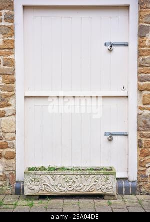 Locked double bolted door in the market town of Uppingham, England. Stock Photo