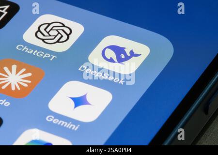 DeepSeek, ChatGPT, Google Gemini, and Claude app icons are seen on the screen of an iPhone. Stock Photo