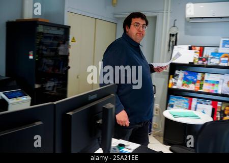 Disabled worker working in the printing, reprography and marking workshop. work with disabilities 016794 030 Stock Photo