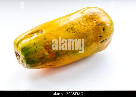 Side view of a large whole ripe papaya isolated on white. Stock Photo