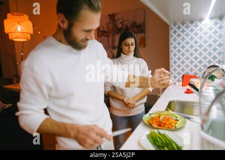Spend a Delightful and Cozy Evening Cooking Together in an Exquisite Modern Kitchen Space Stock Photo