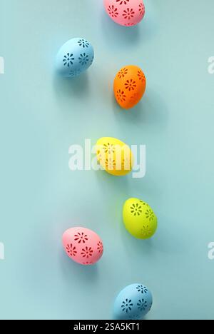 Collection of stylish colors eggs for Easter celebration on blue background. Holiday concept. Stock Photo