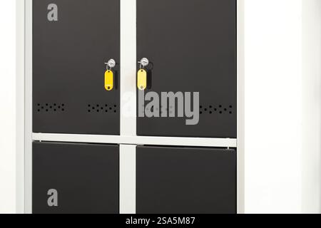 Modern lockers with bright keys indoors, closeup Stock Photo