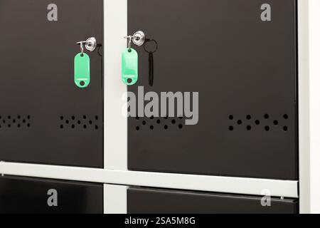Modern lockers with bright keys, closeup view Stock Photo