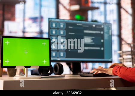 Woman interacting with intelligent AI chatbot on pc next to mockup display, using smart innovative system. Machine learning enhances efficiency and communication through advanced algorithms. Stock Photo