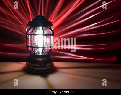 Lantern on a marble table with a white and red light painting effect on the background Stock Photo