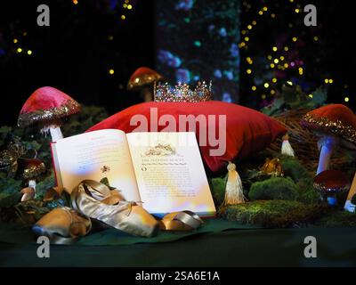 Fairytale book open on a table with toadstools Stock Photo