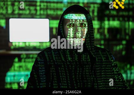 Hacker and projection of programming code in dark room, closeup Stock Photo