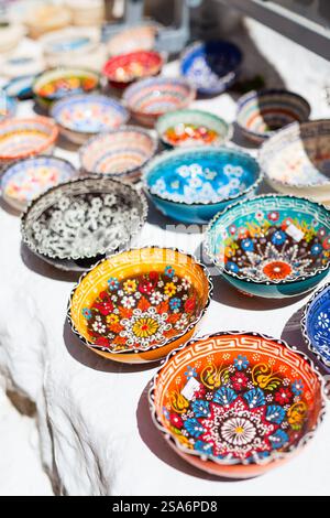 Colorful small ceramic dishes for sale on market Stock Photo