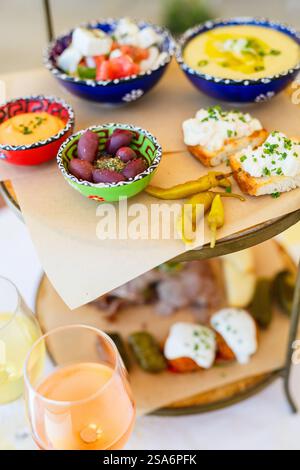 Selection of traditional greek meze: fava, greek salad, stuffed grape leaves and olives Stock Photo