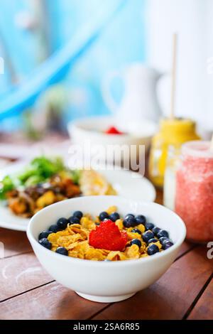 Delicious cereal with milk and fresh berries served for breakfast Stock Photo