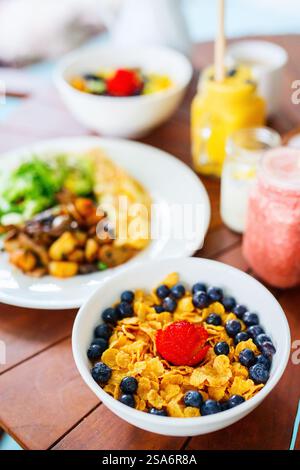 Delicious cereal with milk and fresh berries served for breakfast Stock Photo