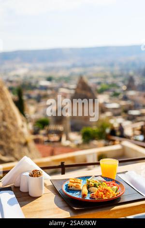 Delicious Turkish breakfast with scrambled eggs served outdoors Stock Photo